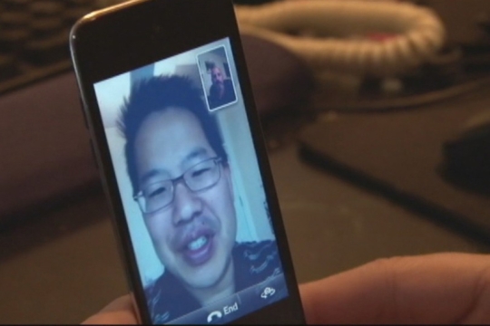 man using Facetime on his phone.
