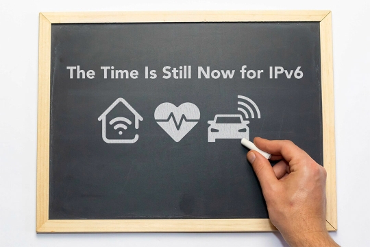 hand writing on a small chalkboard: the time is still now for IPv6.