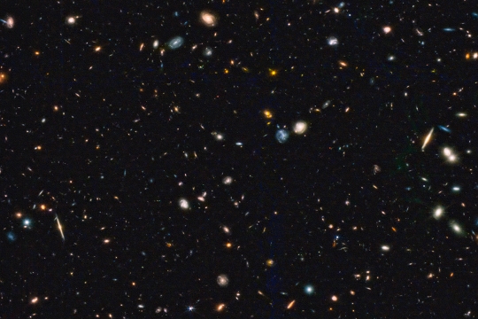 An image of many tiny, distant galaxies taken by the James Webb Space Telescope