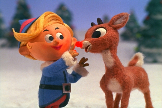 a still from the 1964 animated film Rudolph the Red-Nosed Reindeer, with Rudolph talking with the elf Hermey.