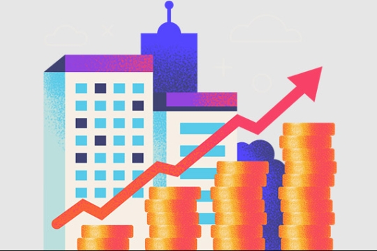 Skyscrapers and coins with an arrow going in an upward trend 