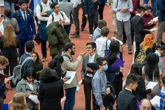 crowd of college students at a job fair.