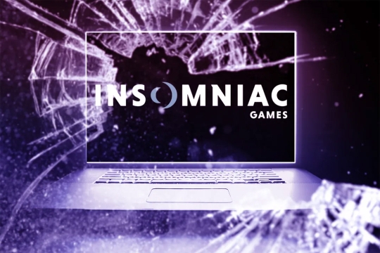 image of broken glass layered over an image of a laptop with the Insomniac Games logo on the screen.
