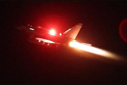 military aircraft flying at night.