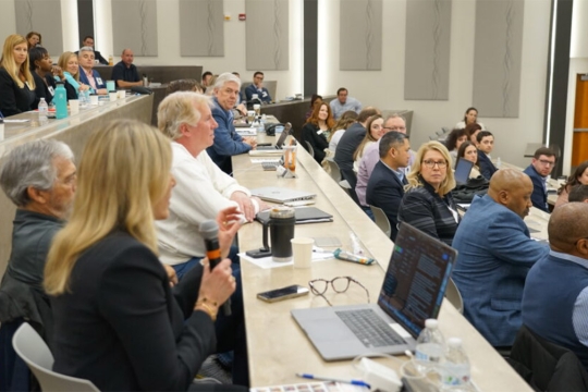 EMBA alumni and students in the new G auditorium.