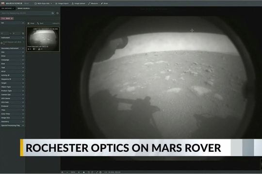 Black and white photo of Mars. Headline says Rochester Optics on Mars Rover.