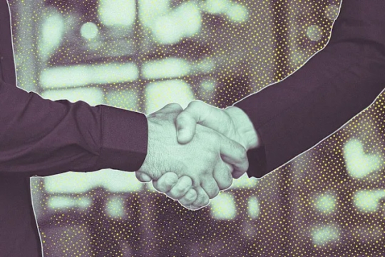 two hands shake in a newsprint style design.