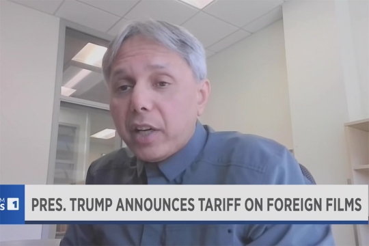 Amit Batabyal appears on screen with a chyron displaying his name and the Spectrum logo.