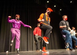 Members of Brick City Boppers perform on stage.