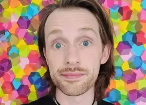 A headshot of a person on a multicolored background.