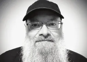 A black and white portrait of Powder Jay.