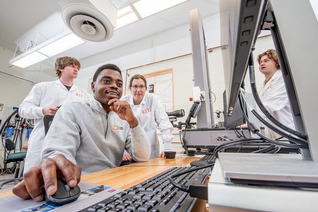 Students walking out of the campus giving hi-five to each other