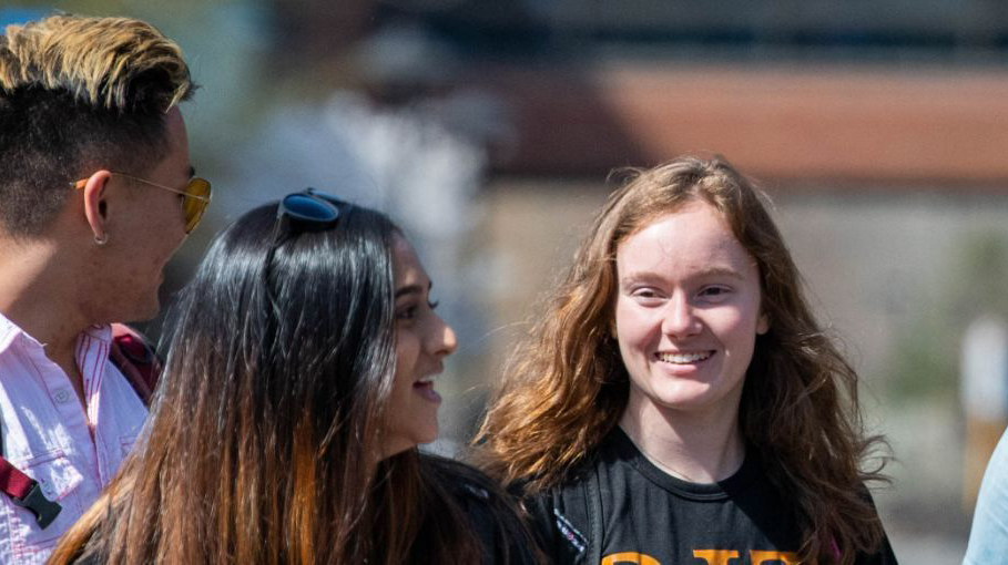 Students talking on campus.