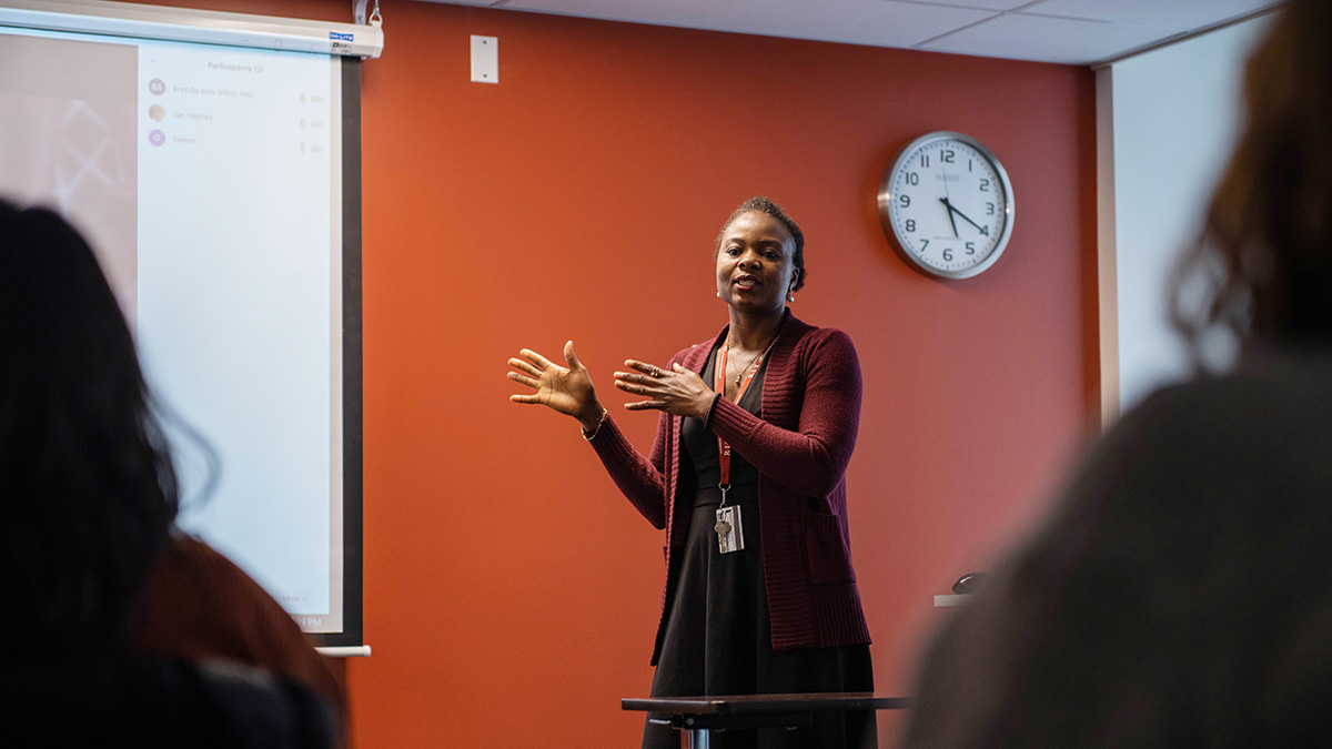 A professor addressing students in a classroom