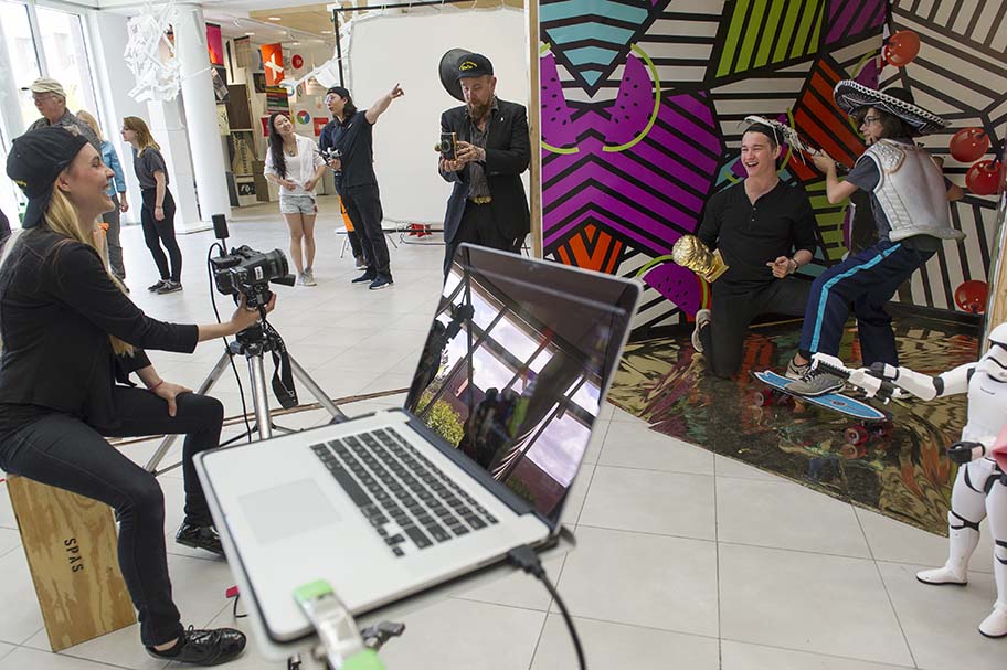 Student creating colorful sculptures