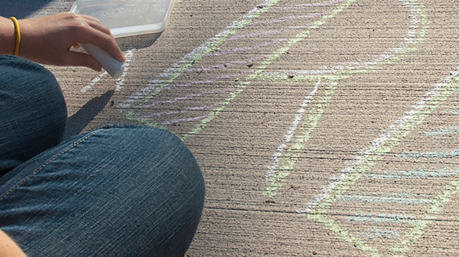 The letters RIT written in chalk on the ground.