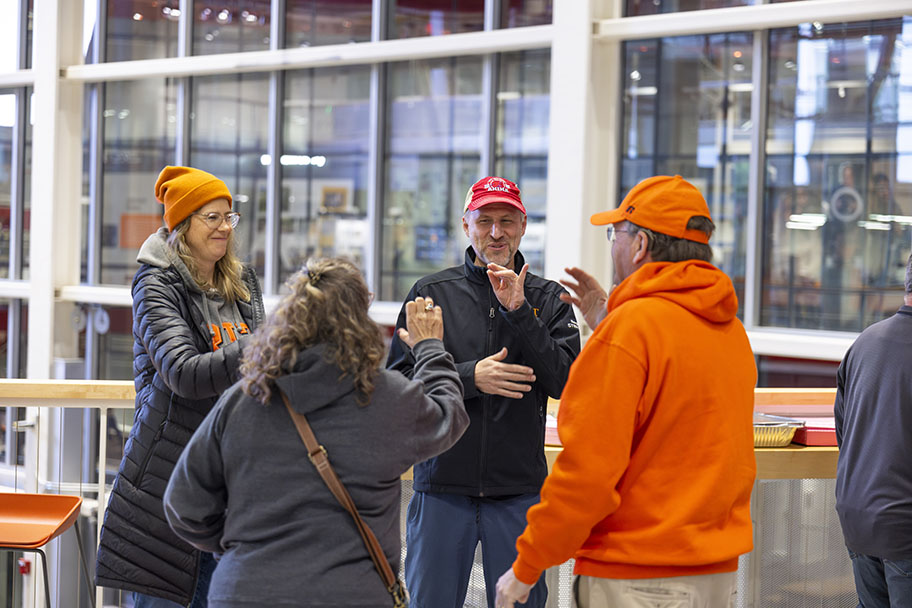 Alumni chatting in sign language