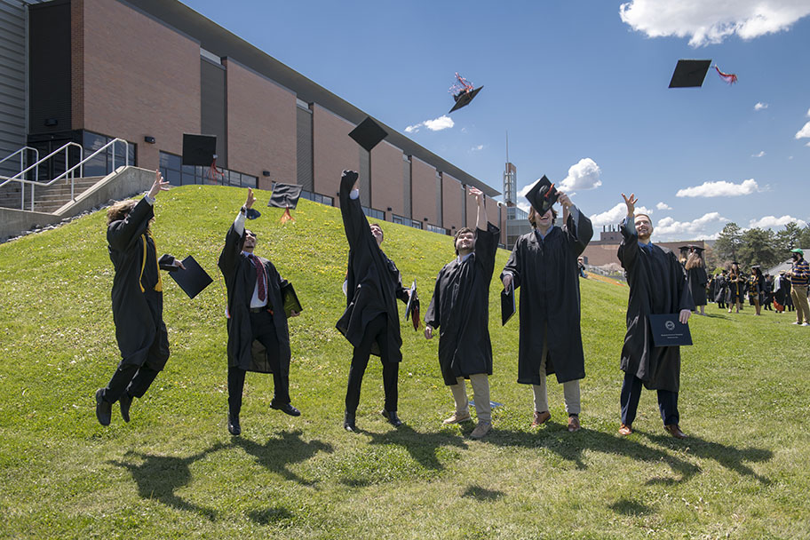 Students tossing their caps into the air.