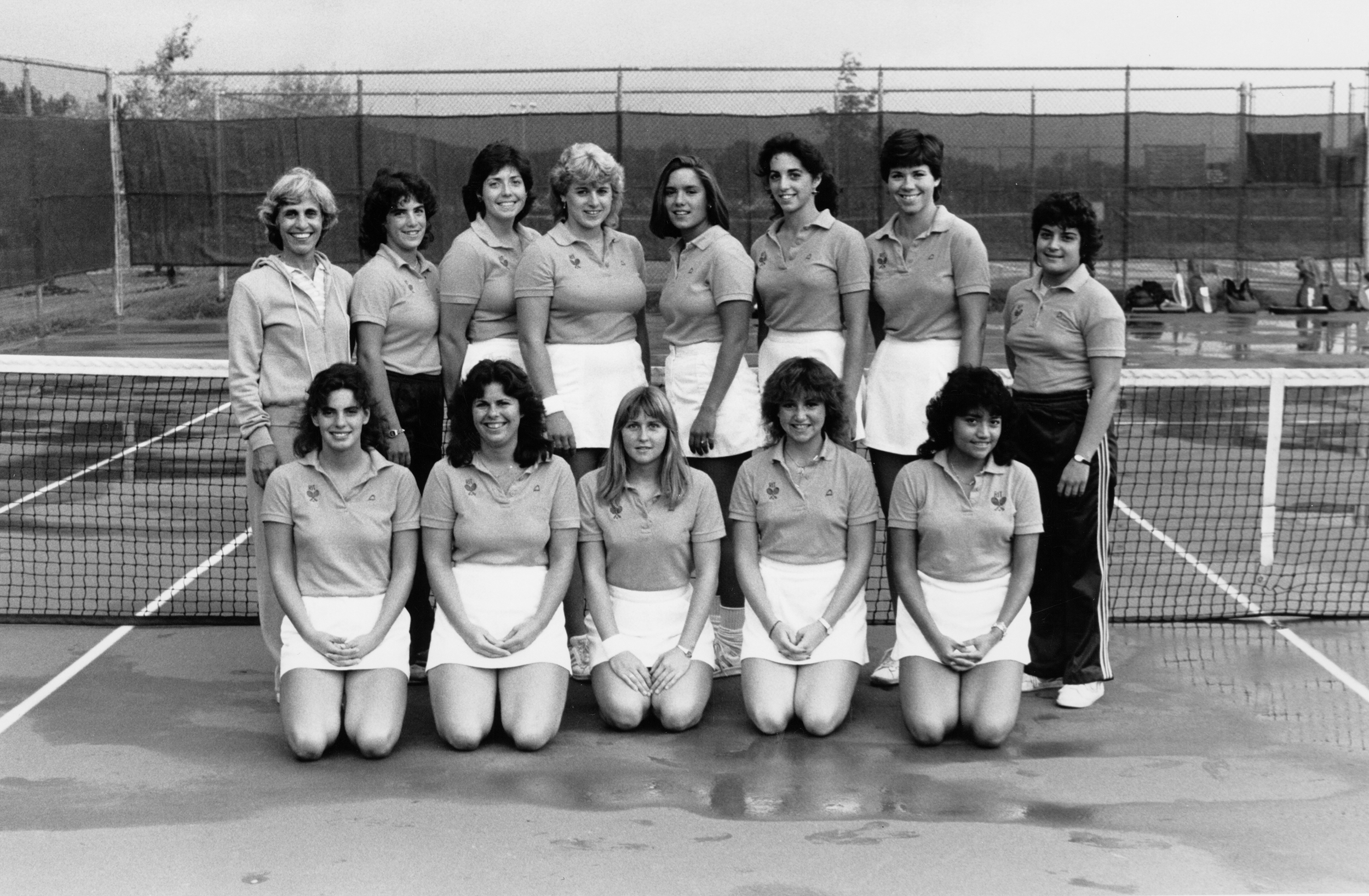 Black and White photo of Anna Nealon In a track jacket standing outside with a smile