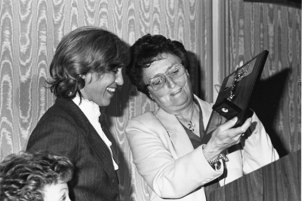 image of two ladies looking at the 1984 awards
