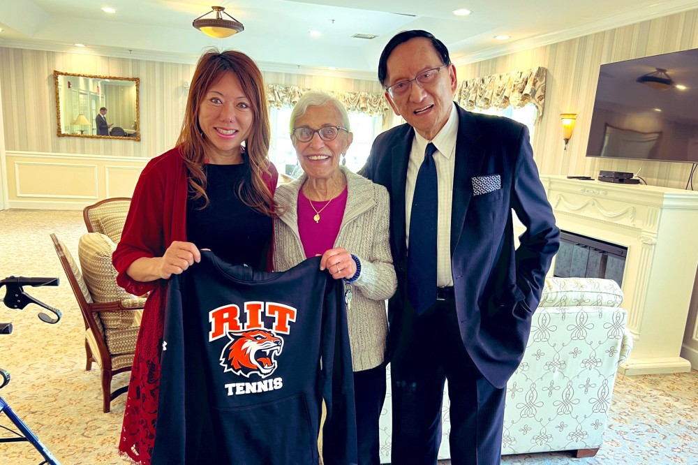 California Secretary of State and RIT alumna Fiona Ma and her father posing with legendary RIT tennis coach Ann Nealon