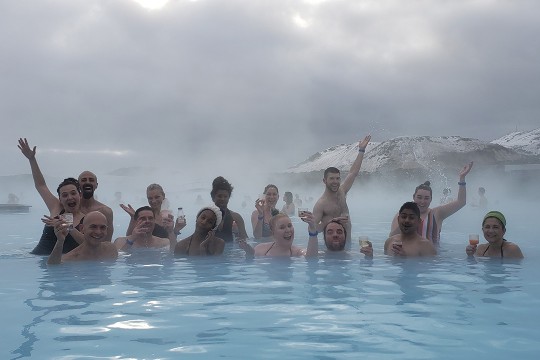 Group of people in lagoon.