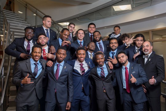 group of students wearing suits.