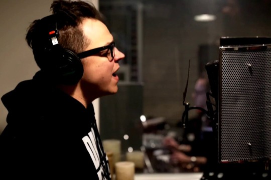 person singing in a recording studio.