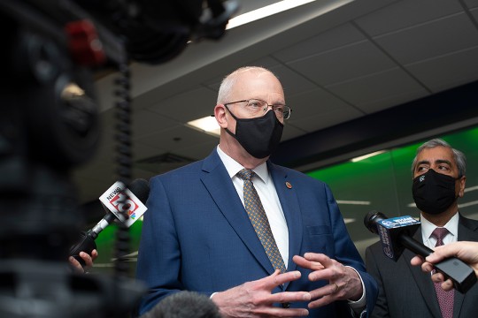 RIT president Munson talking to TV reporters.