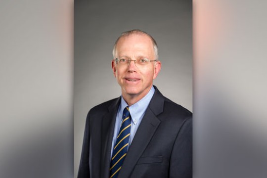 RIT president posing for camera