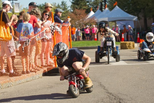 People driving scooters