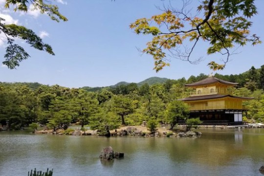 a Japanese structure near a body of water.