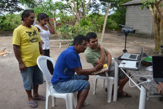 People working around desk