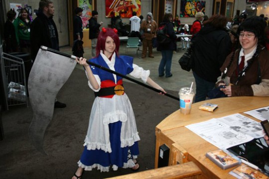 Person posing in costume at event