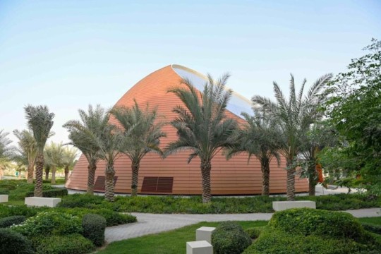 a cone-shaped building with a large window that looks like a microchip.