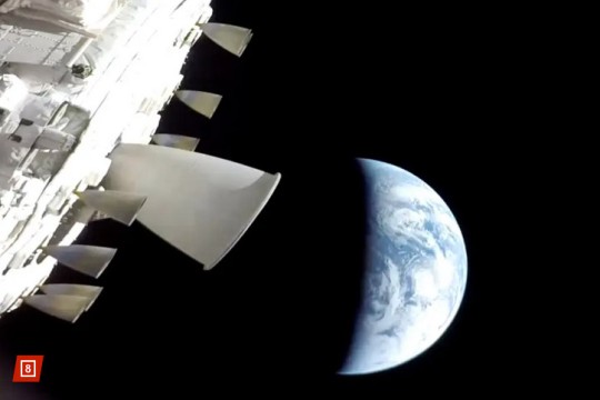 The Orion spacecraft in orbit with Earth in the background.