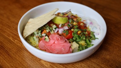 Build your own Indian bowl of rice, colorful veggies, and pita bread.