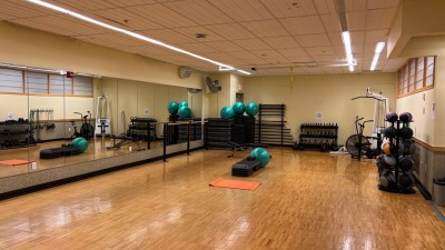 Indoor aerobics room with a yoga mat and ball