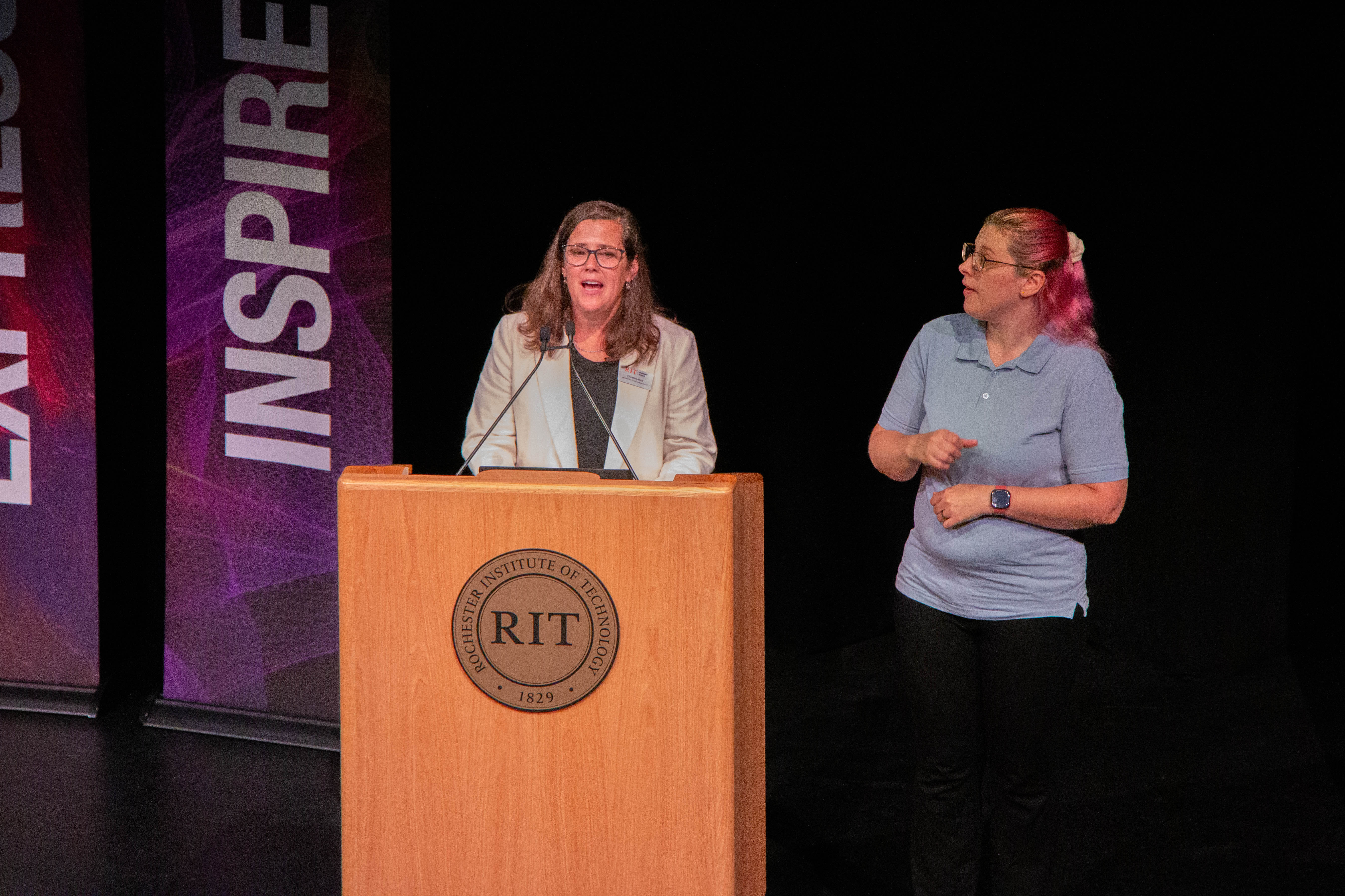 Christie Leone, Assistant Dean for the Graduate School addresses new graduate students