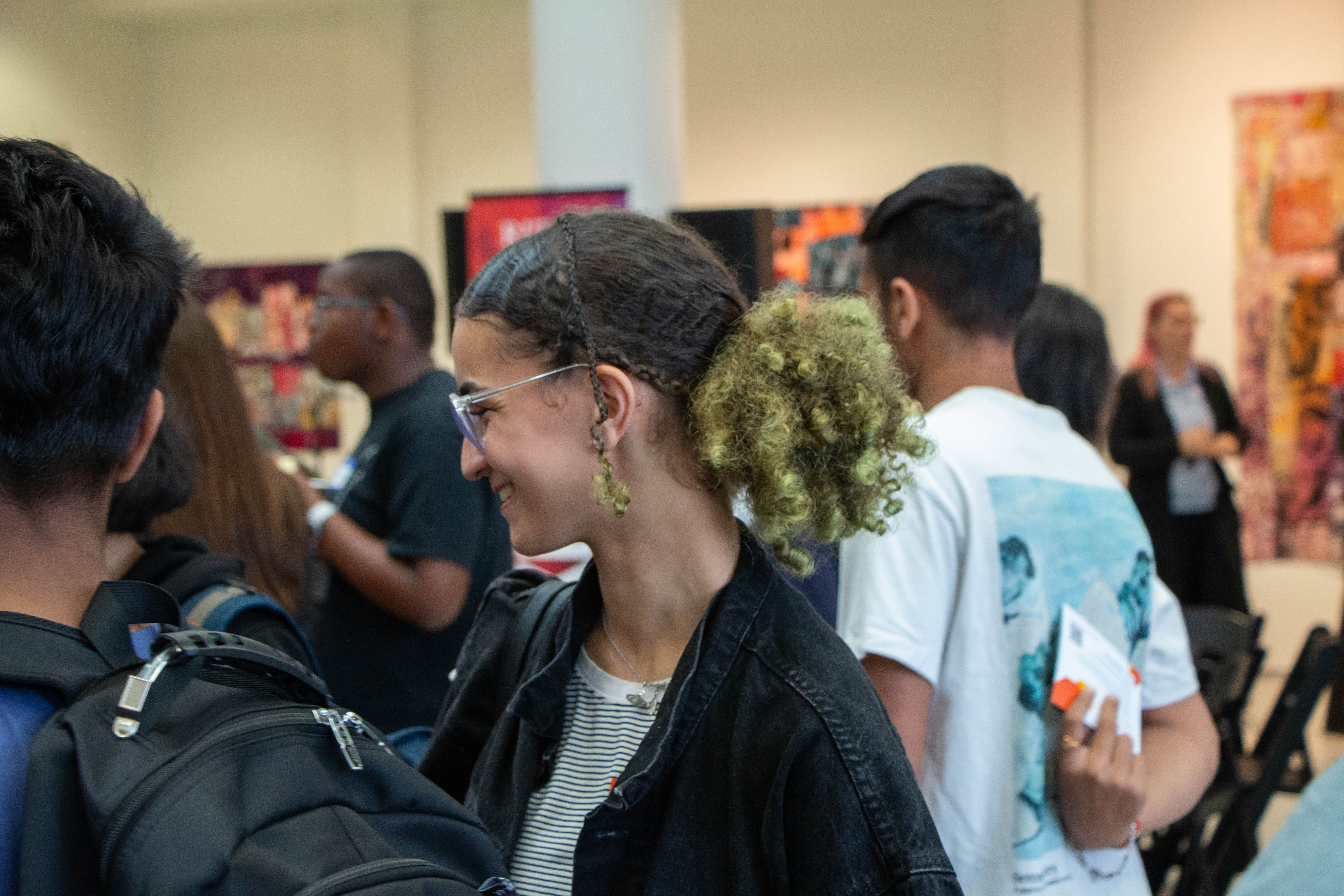 student talk to each other in the university gallery