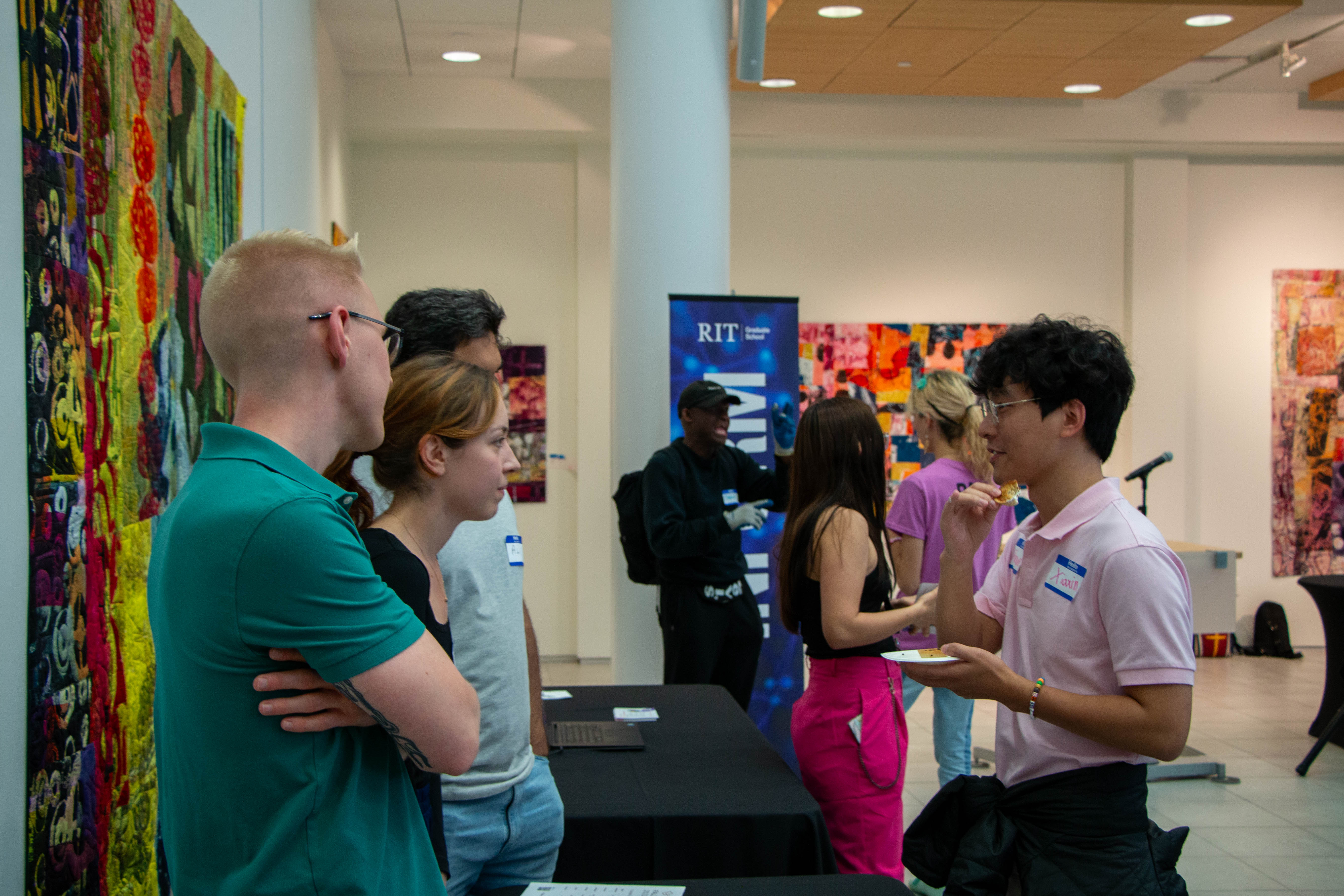 student talk to members at the DSA table