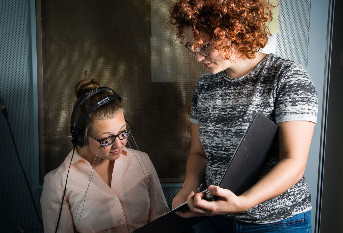 one student instructing another student through a study 