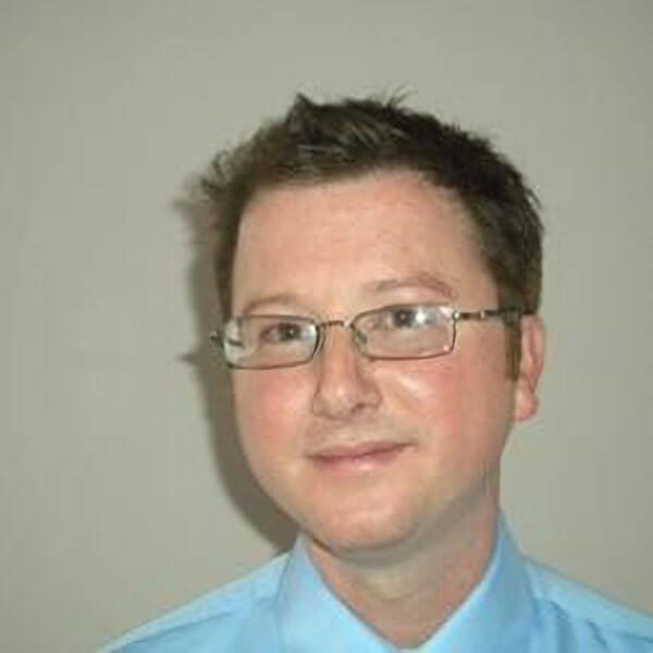 Headshot of Chris Dehon.