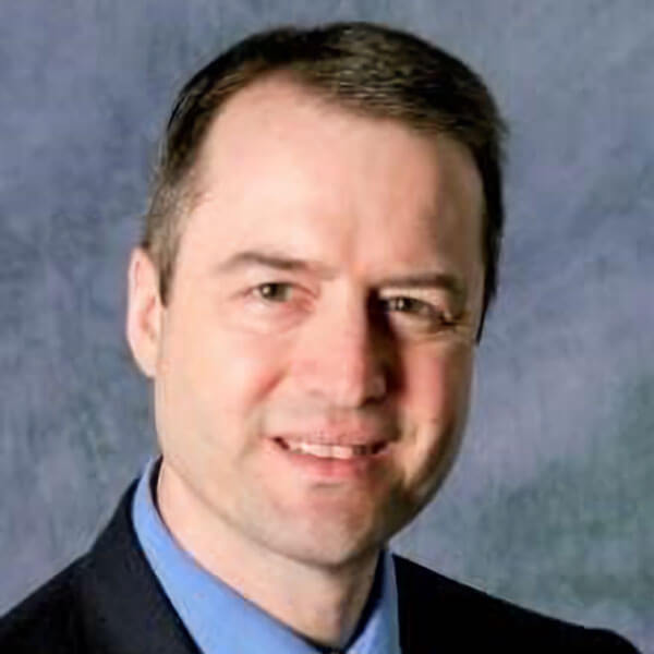 Headshot of William Schneider.