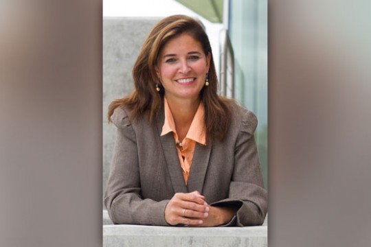 Person posing for camera at table