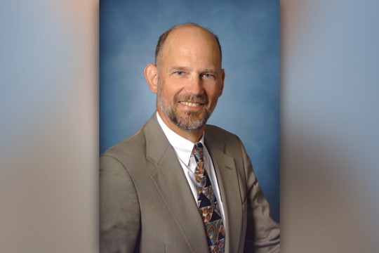 Professor posing for camera