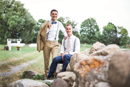 couple poses on boulders.