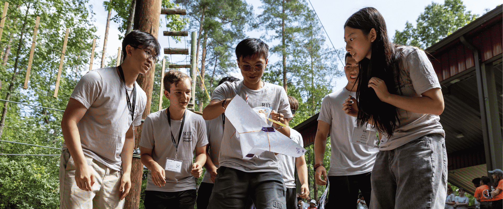 students gathered around a successful egg drop