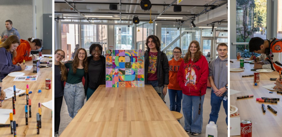 Honors students gathered around an art piece they made smiling at the camera