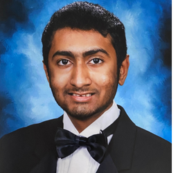 Srikar headshot on blue backgroud. Srikar is wearing a bow tie and black sportcoat.